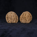 Angled front view of The General's Crest Wenwan walnuts showing their warm color and intricate vertical texture.
