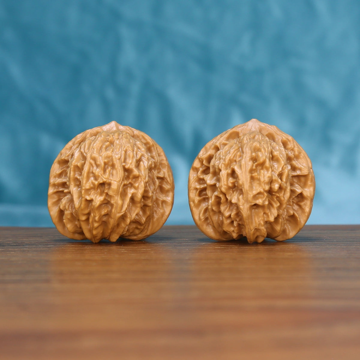 Coiling Dragon wenwan walnut pair 6149 shown side by side, front view of the carved dragon pattern
