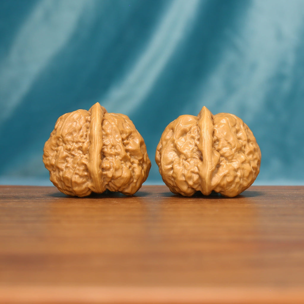 The Azure Rosette L38 wenwan walnut pair, angled side view
