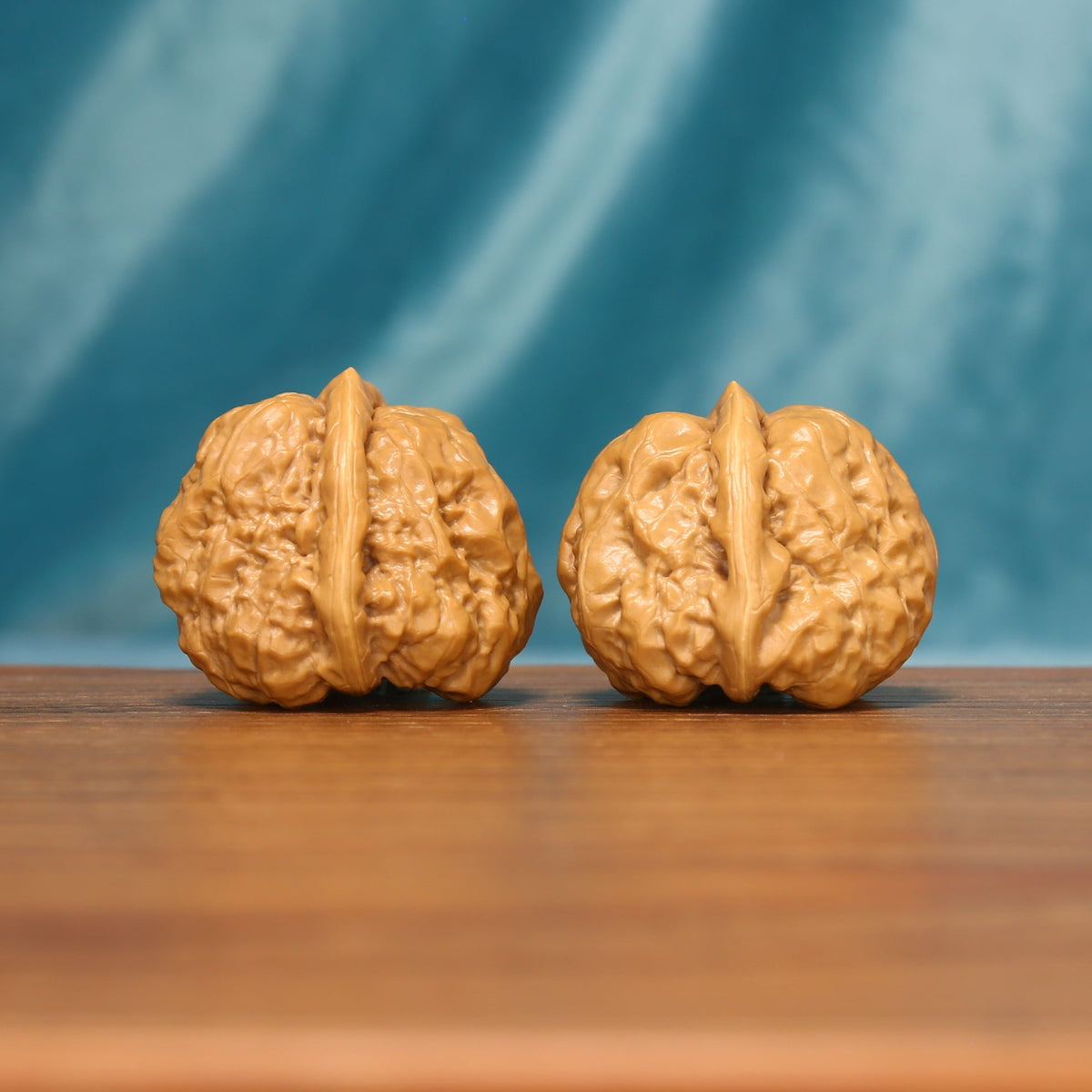 The Azure Rosette L38 wenwan walnut pair, angled side view

