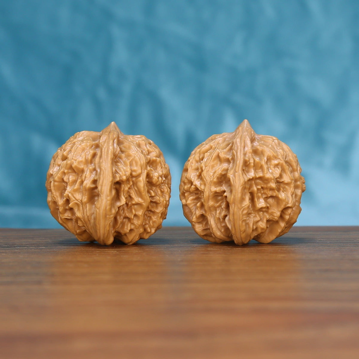Coiling Dragon wenwan walnut set seen from a slight angle, highlighting the rounded belly and even shape
