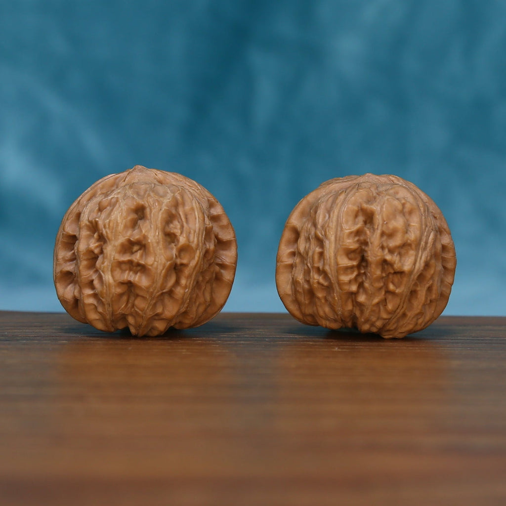 The Quiet Asymmetry | L04 Wenwan Walnut Set Matched pair of L04 Wenwan walnuts showing natural ridges and rounded form