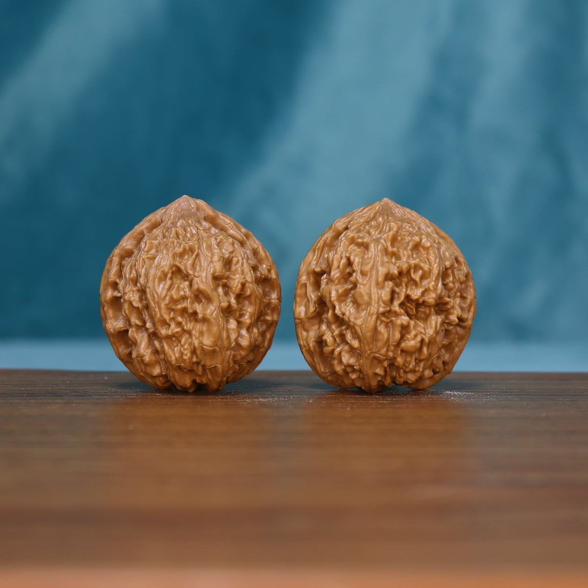 Pair of 6209 Rosette Ridge wenwan walnuts with raised winding ridges
