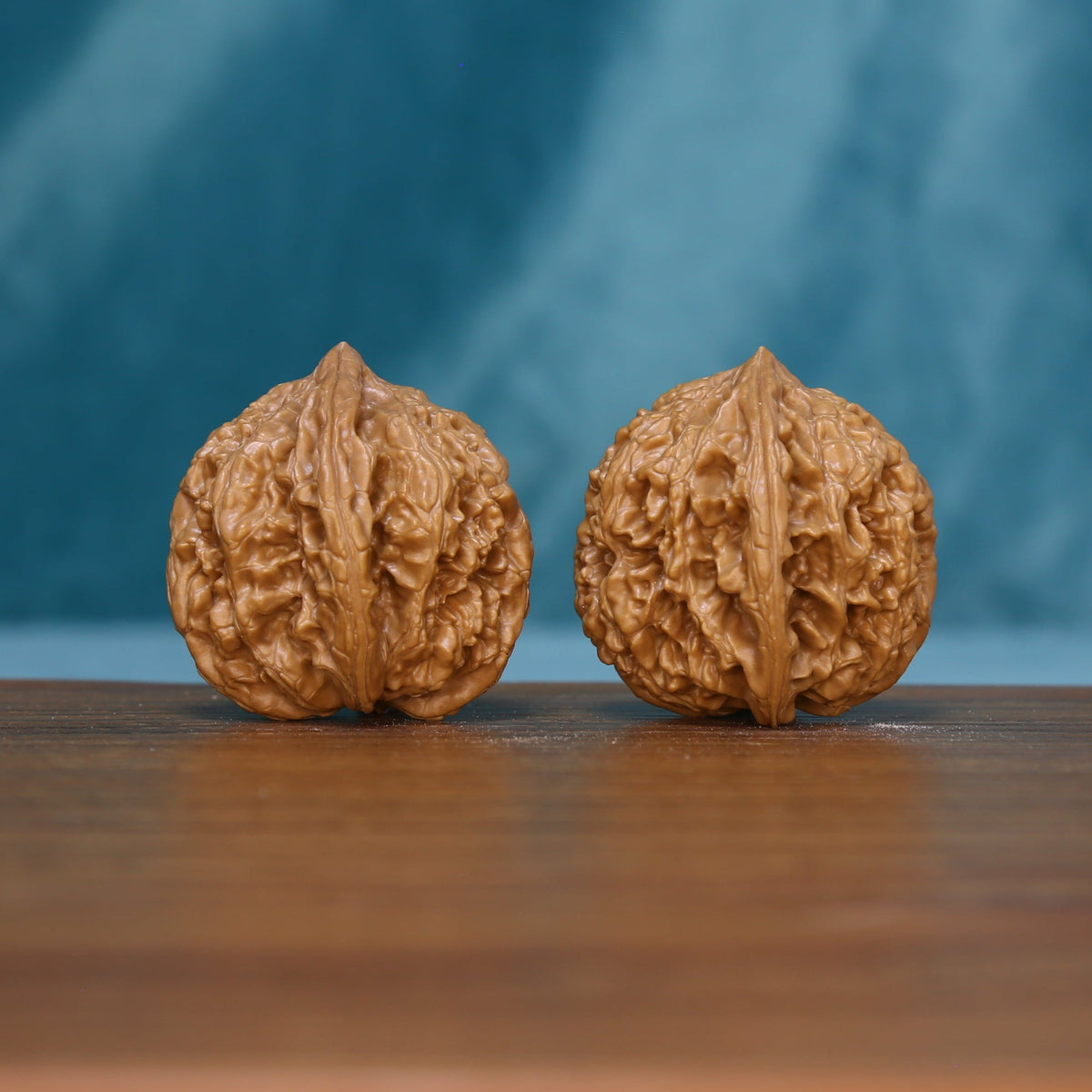 Front view of two 6209 Rosette Ridge wenwan walnuts with branching grooves
