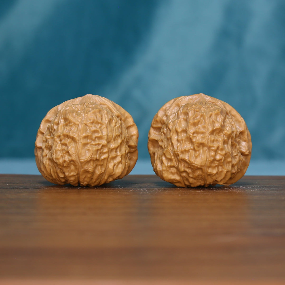 6094 wenwan walnut pair showing warm tan surfaces and branching grooves
