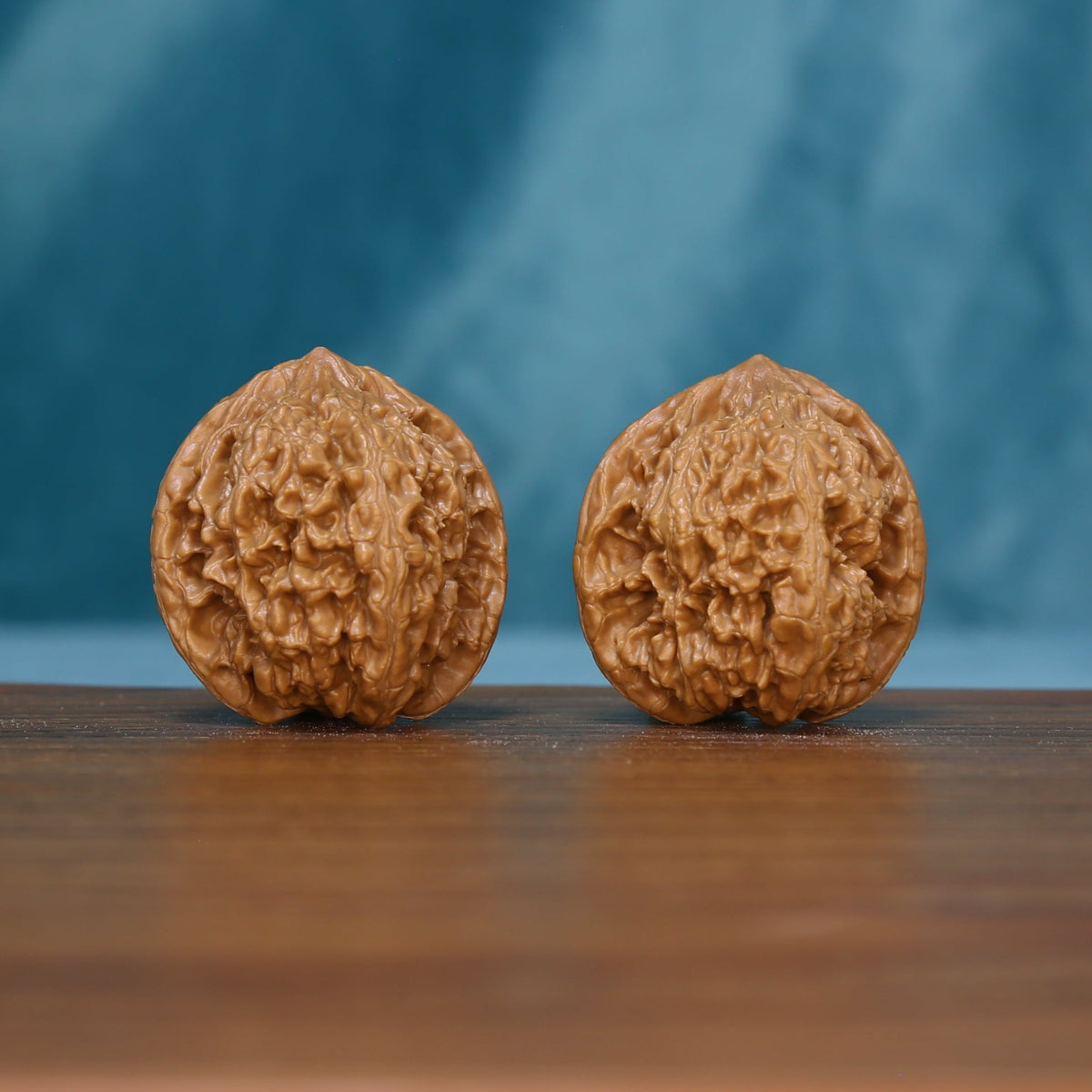 Pair of 6136 Winding Crown wenwan walnuts with raised winding grooves
