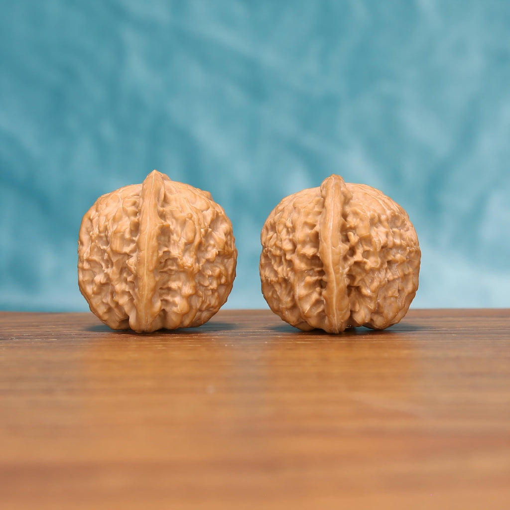 Yuan-Bao walnut set side view – non-abrasive pressure point massage and Wabi-Sabi natural form