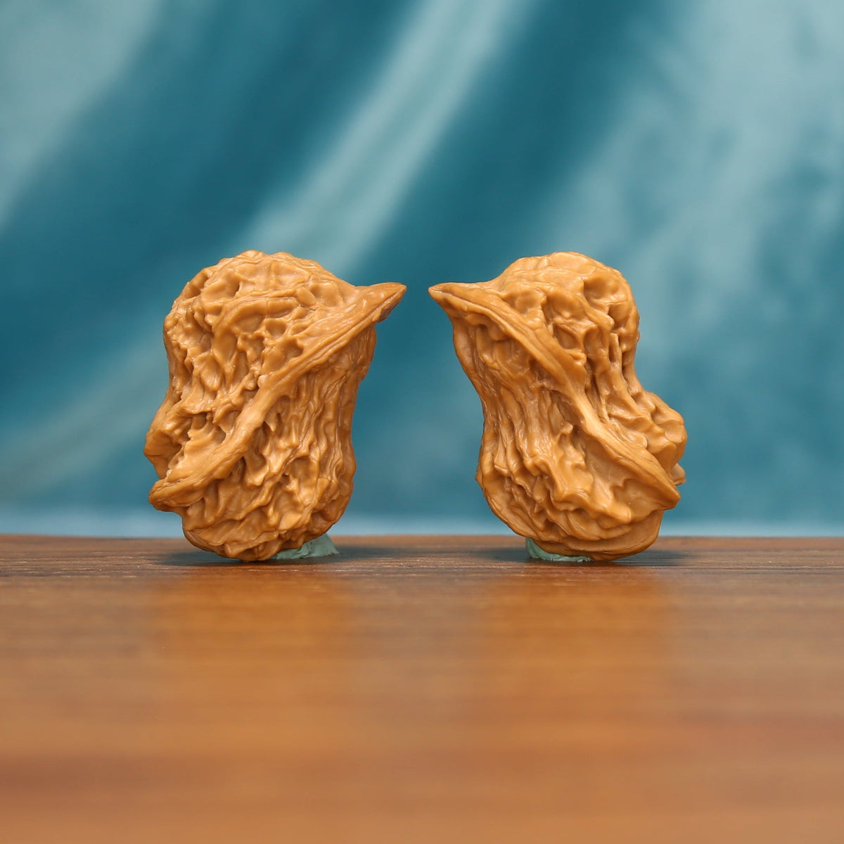 The Longform Twins L36 walnut pair, rotated view showing natural textured sides
