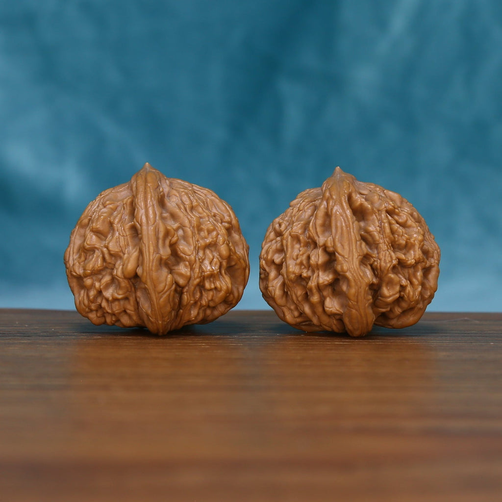Rear view of The Bronze Relics Wenwan Walnut Set displaying the walnuts’ rounded surfaces and deep natural texture.
