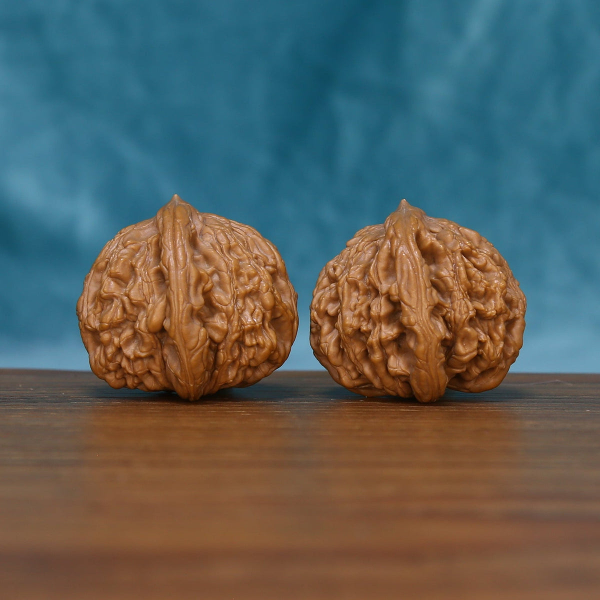 Rear view of The Bronze Relics Wenwan Walnut Set displaying the walnuts’ rounded surfaces and deep natural texture.
