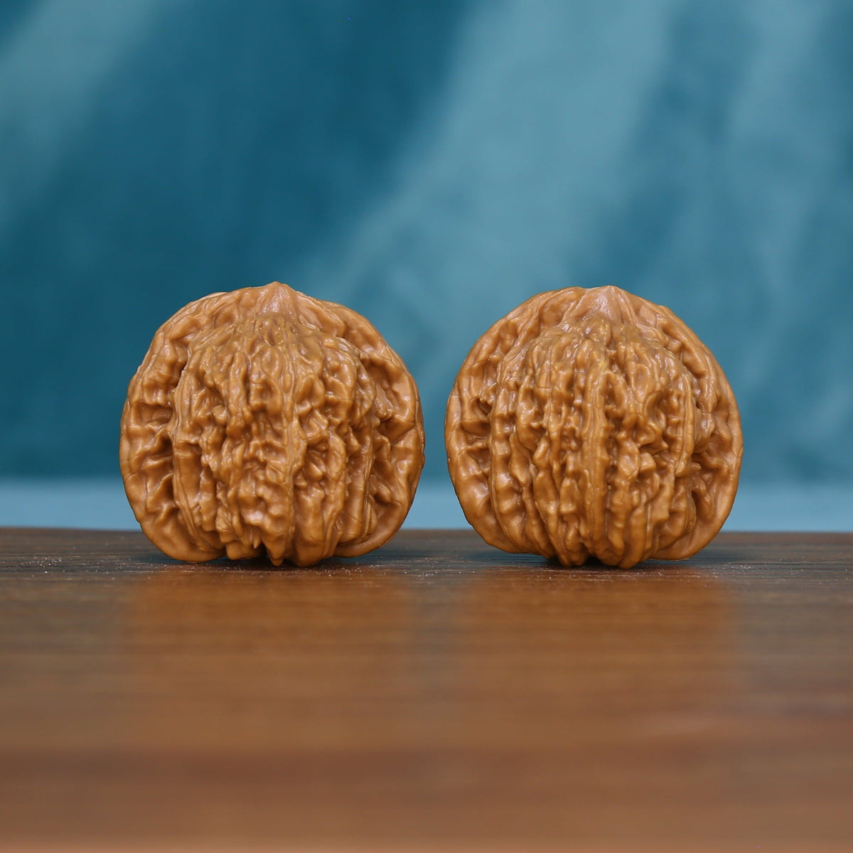 Pair of 6123 Close Match wenwan walnuts showing raised ridges and grooves
