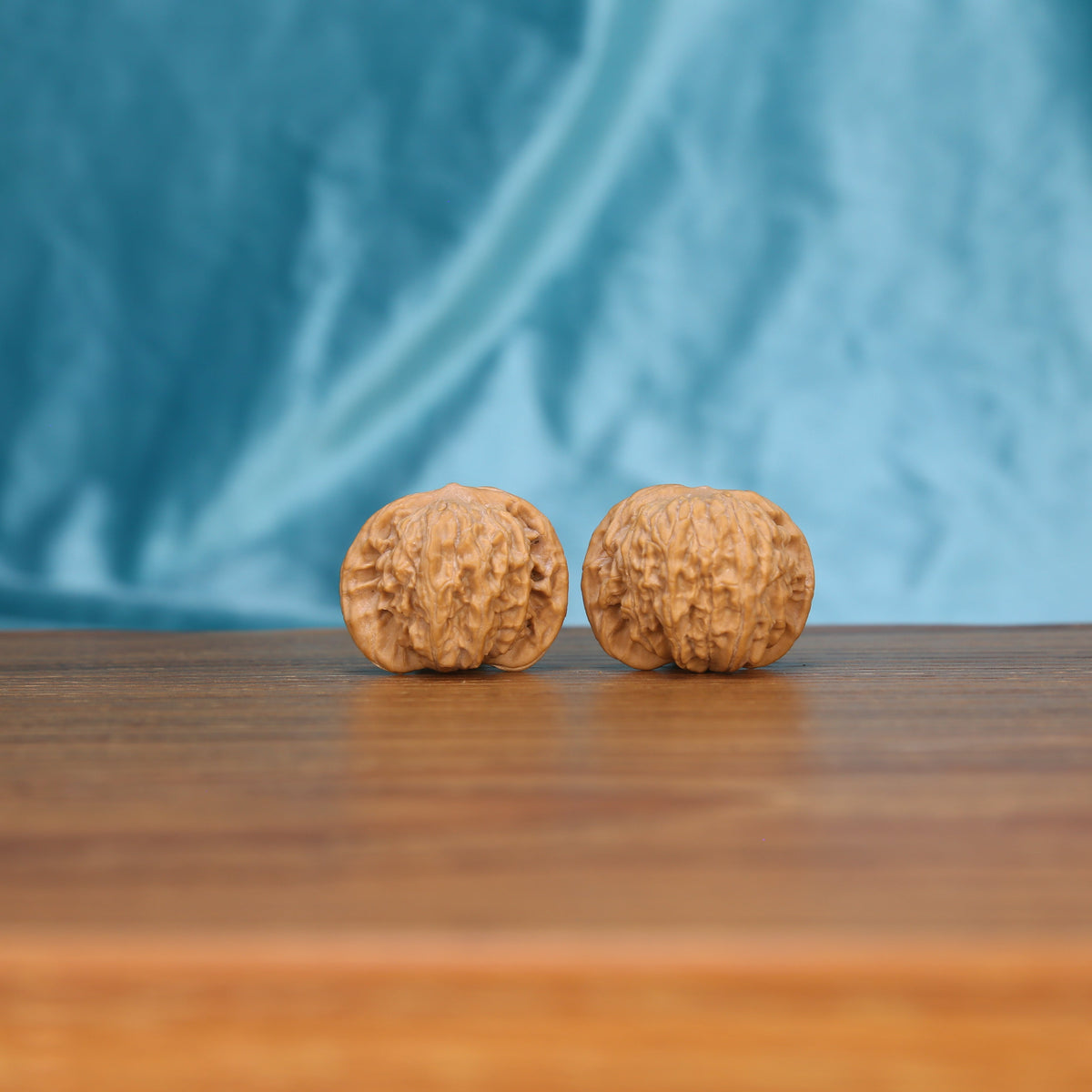 W3993 Muted Zenith walnut duo on wooden surface – broad flat topography and horizontal ridges
