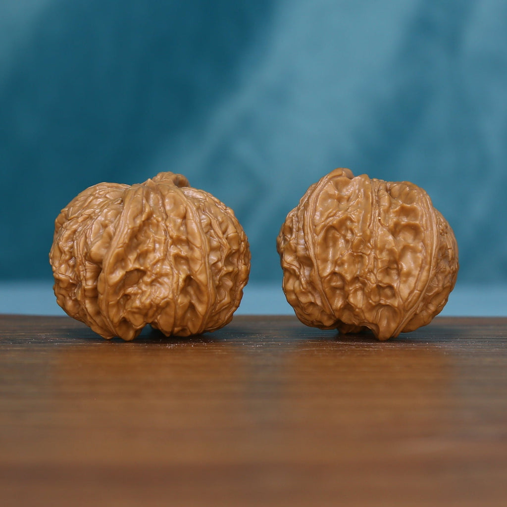 6133 Starburst Crown wenwan walnuts showing their rounded profiles and natural grooves

