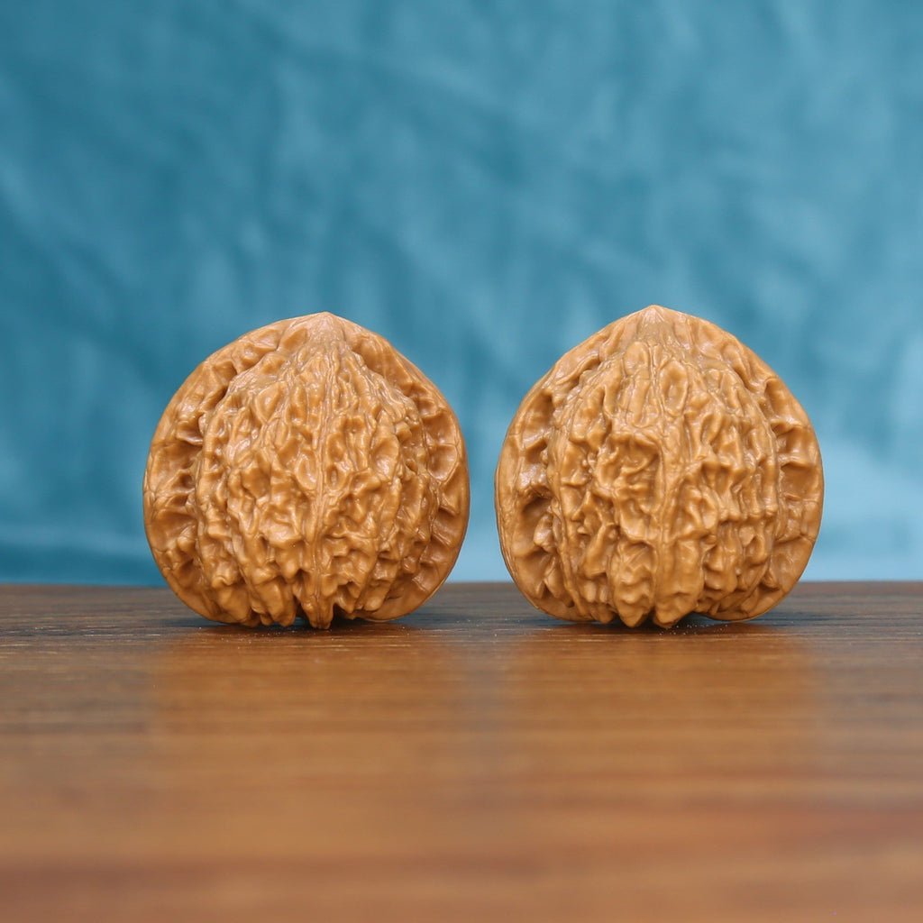 Little Golden Ox wenwan walnut pair 6204 shown side by side, front view of the matched slim shape
