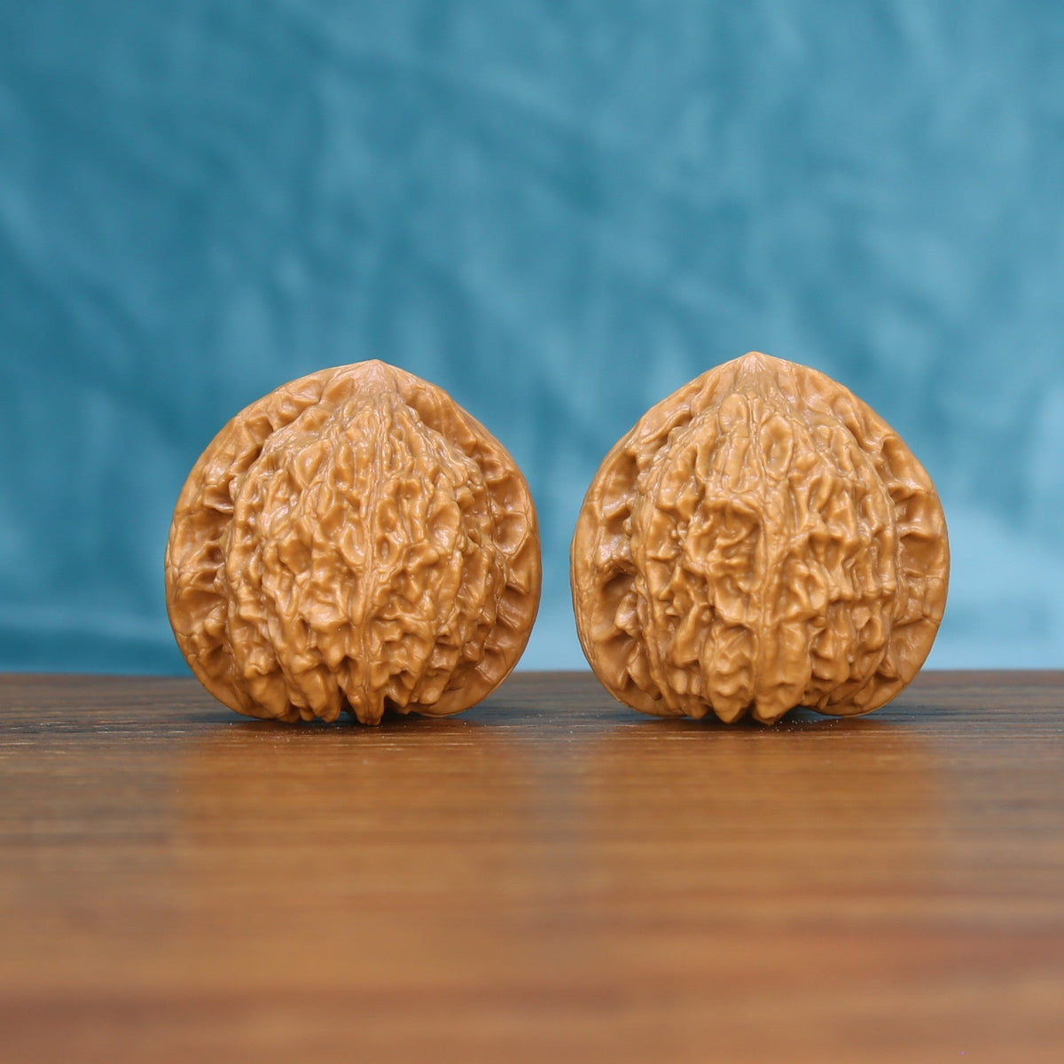 Little Golden Ox wenwan walnut pair 6204 shown side by side, front view of the matched slim shape
