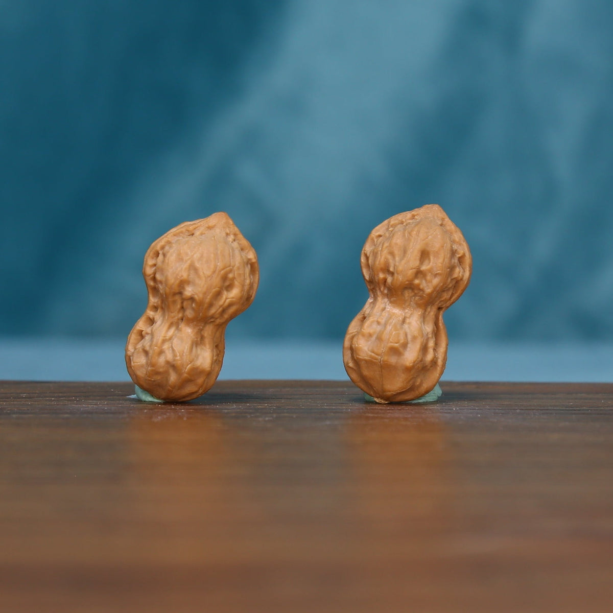 Pair of L44 Peanut Gourd wenwan walnuts standing upright, showing their narrow waists

