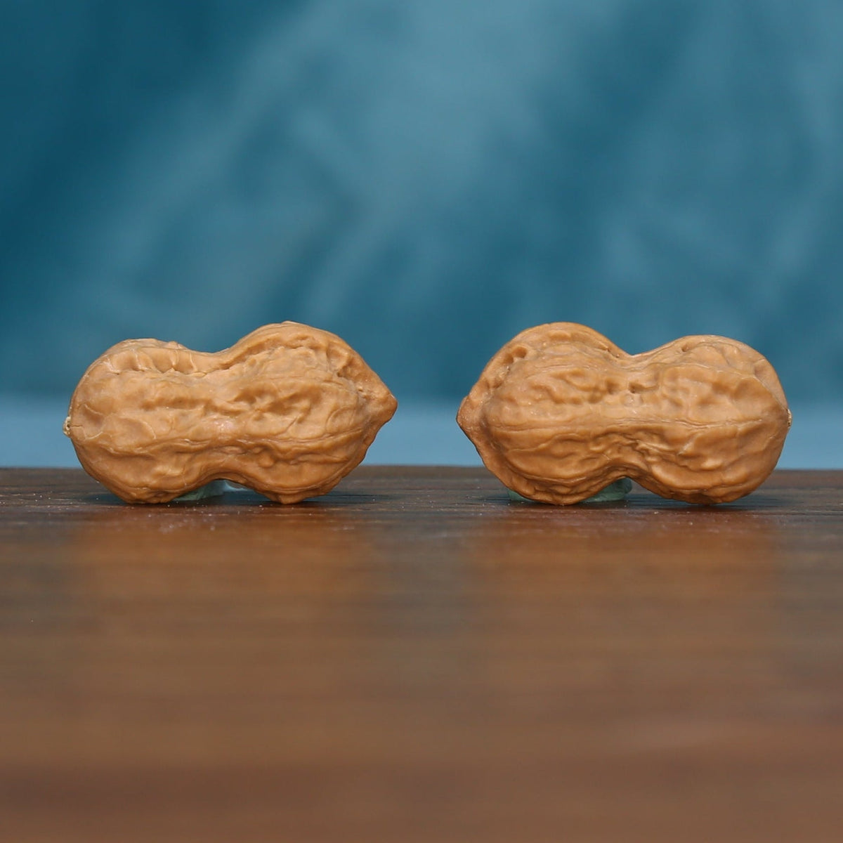 L44 Peanut Gourd wenwan walnut pair laid on their sides, showing the double-lobed shapes
