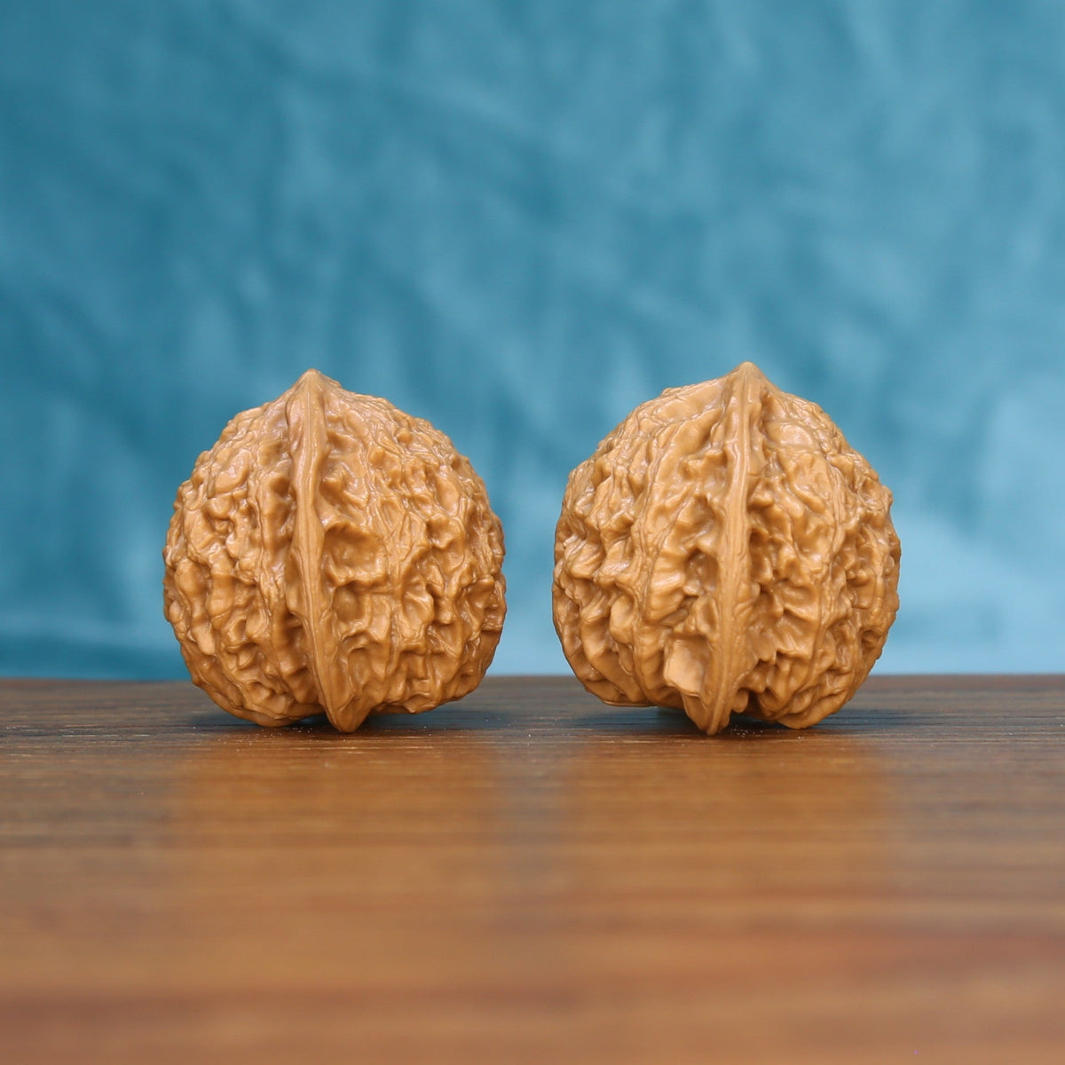 Little Golden Ox wenwan walnut set at a slight angle, highlighting the pointed top and narrow belly

