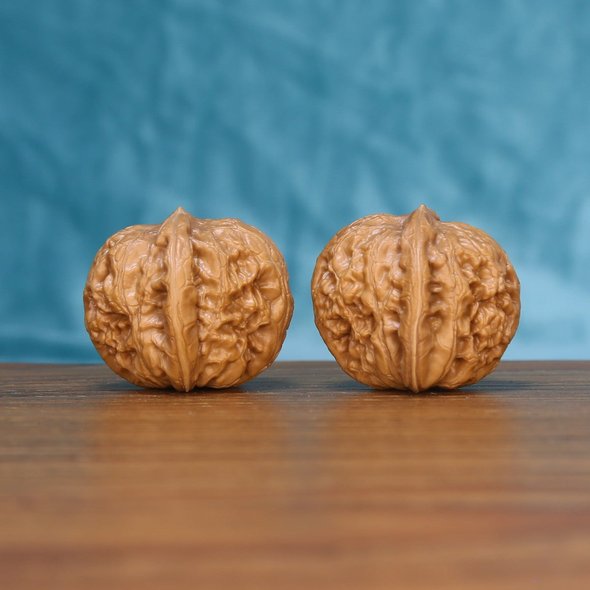 Pinggu Ingot wenwan walnut set at a slight angle, highlighting the wide belly and compact height

