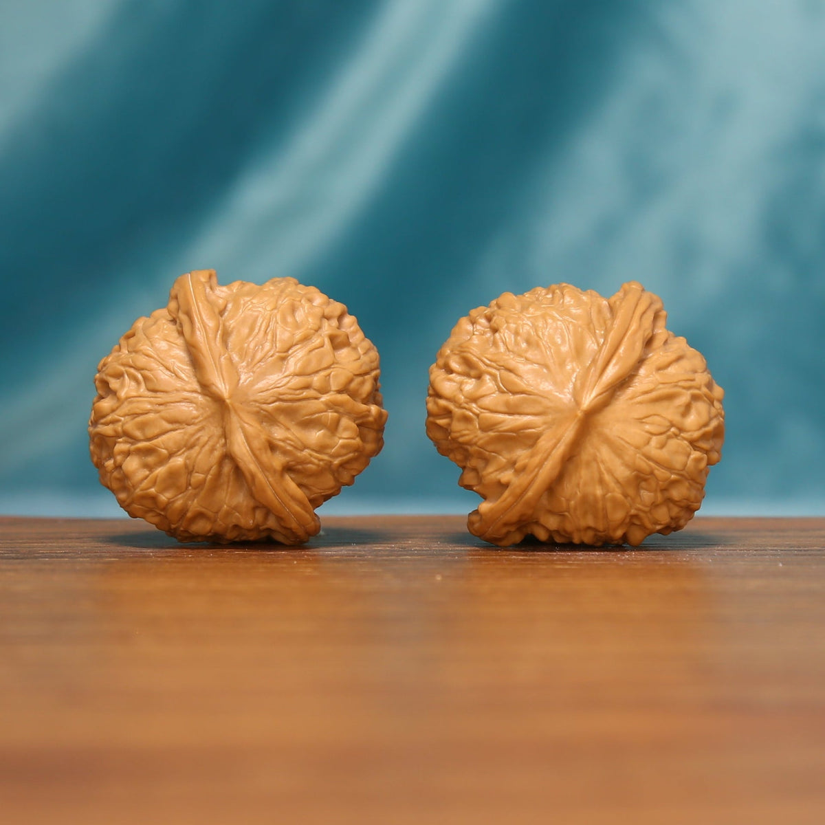 Rear view of The Amber Drum Wenwan Walnut Set showing rounded shapes and sculptural texture.
