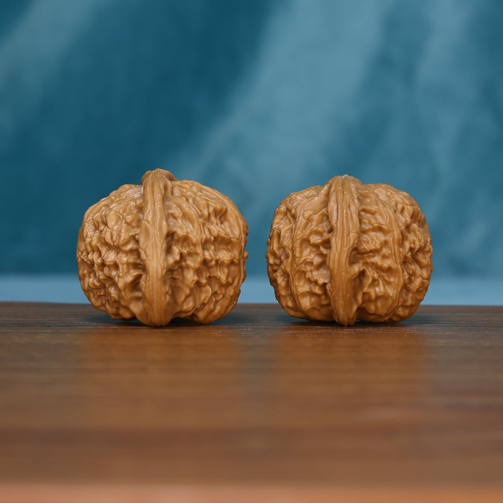 Side view of the S45 White Lion wenwan walnut pair showing pronounced ridges
