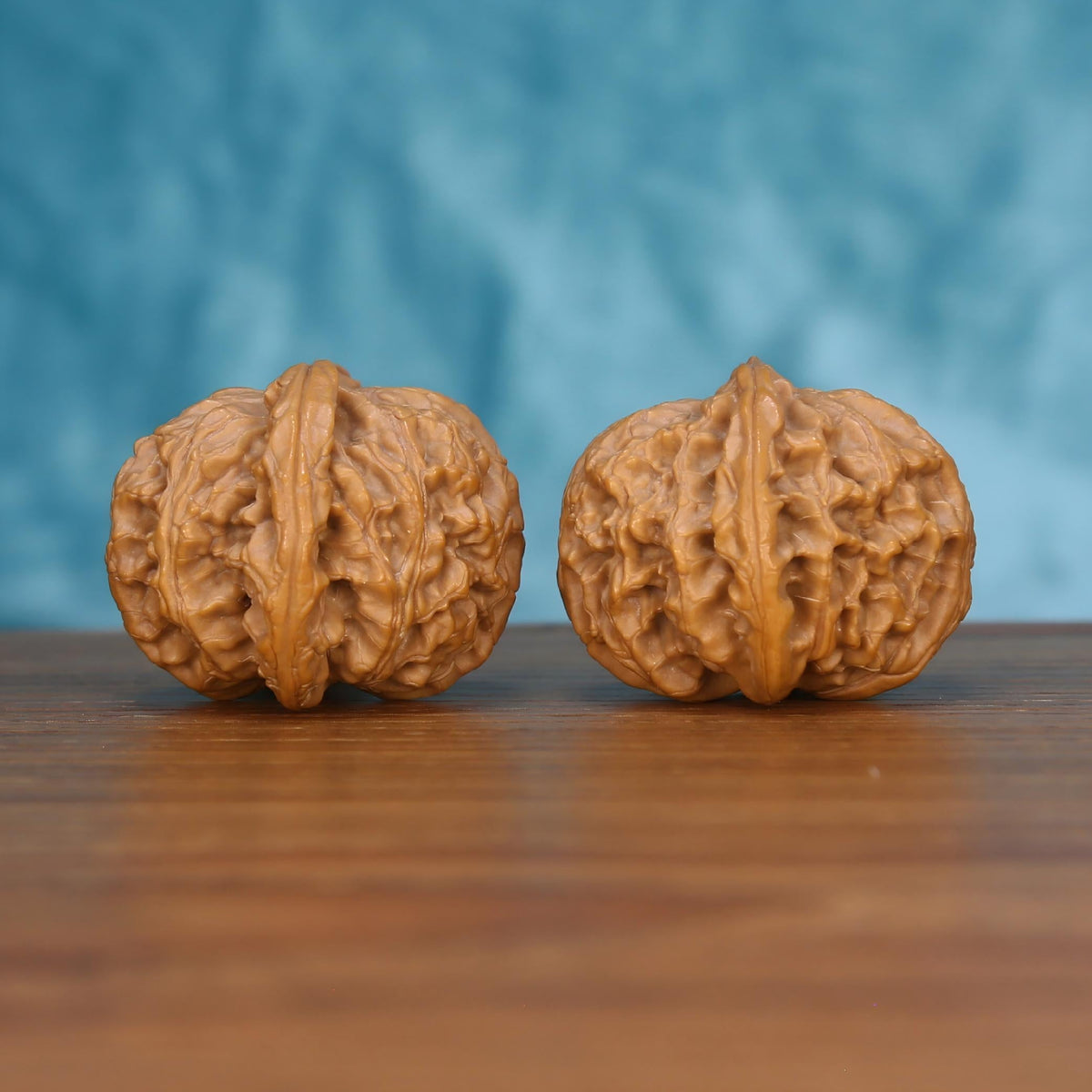 CWY10 Wu-Ming walnut pair by mistbodhi, opposite side view revealing asymmetric organic texture
