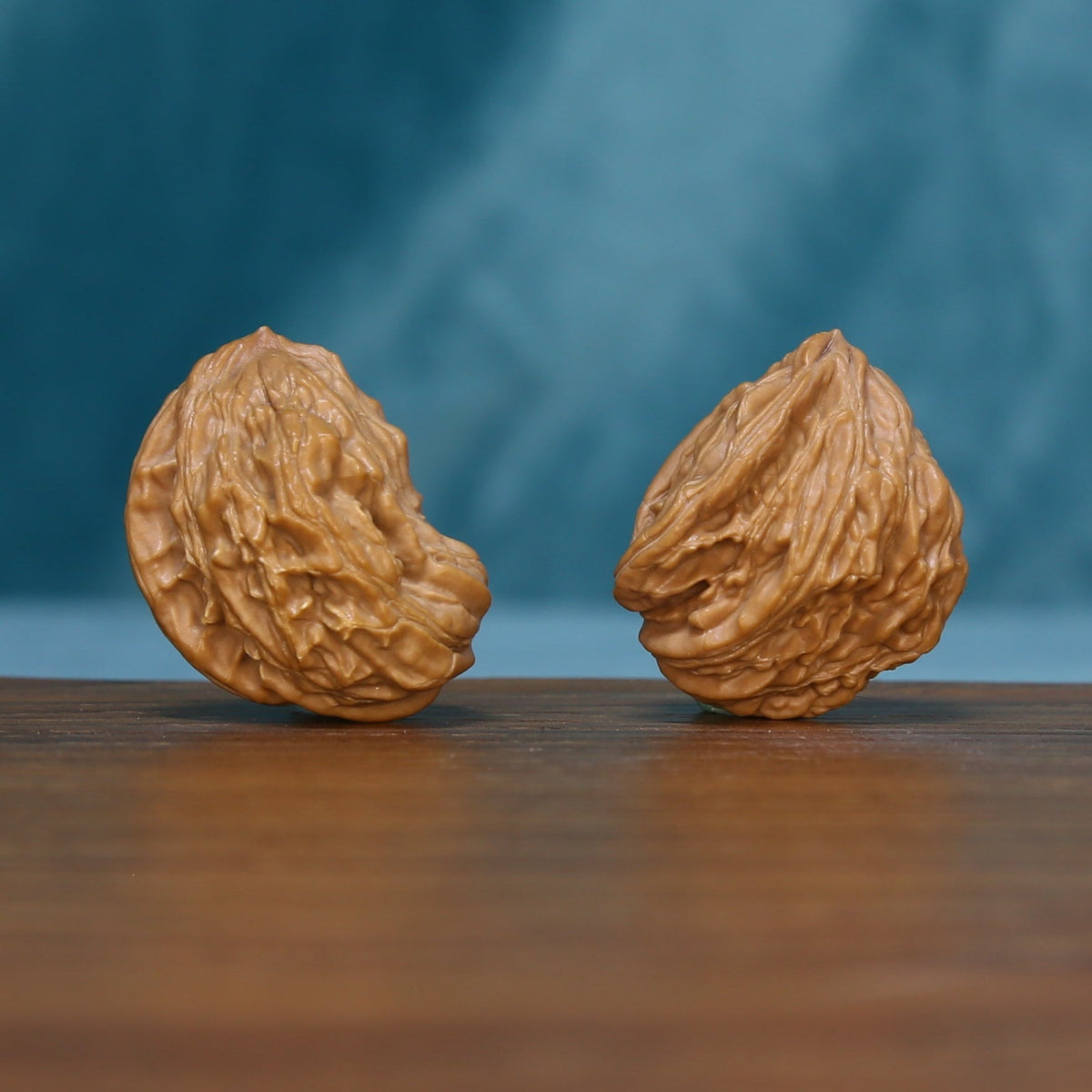 Angled view of the 1789 wenwan walnut pair with raised winding ridges
