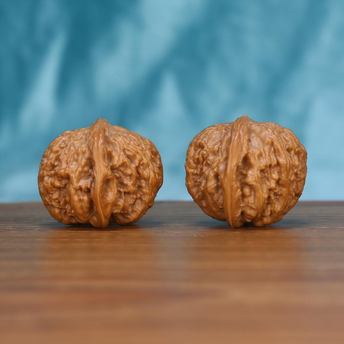 Wu-Ming wild wenwan walnut pair alternate angle, blue background – symmetrical silent enigma ridge pattern