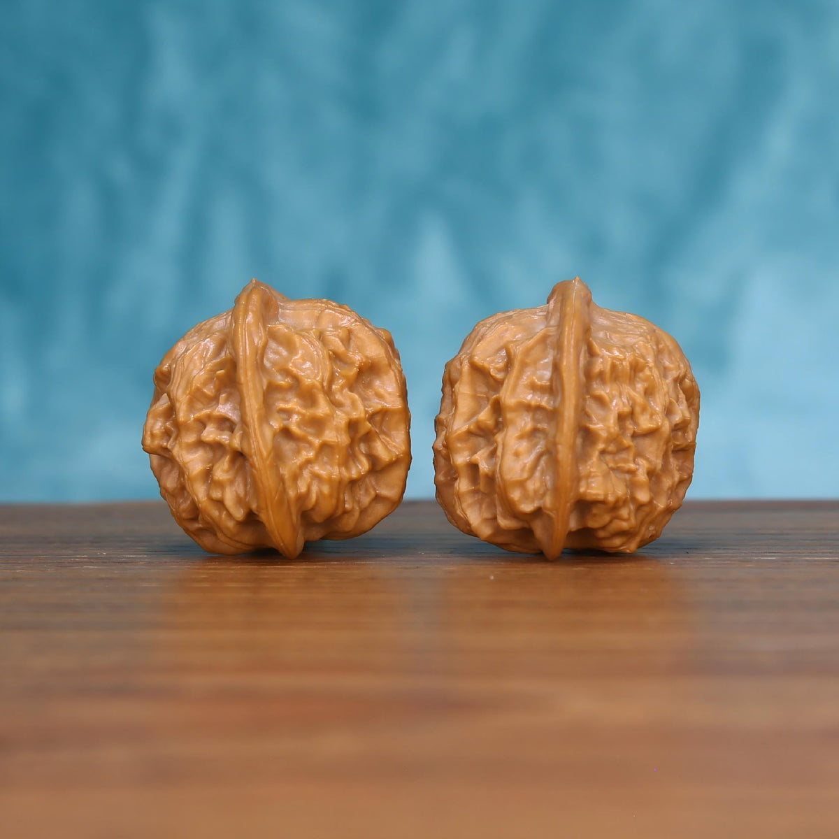 Wu-Ming wenwan walnut pair alternate angle, blue background – symmetrical quiet nomad ridge pattern