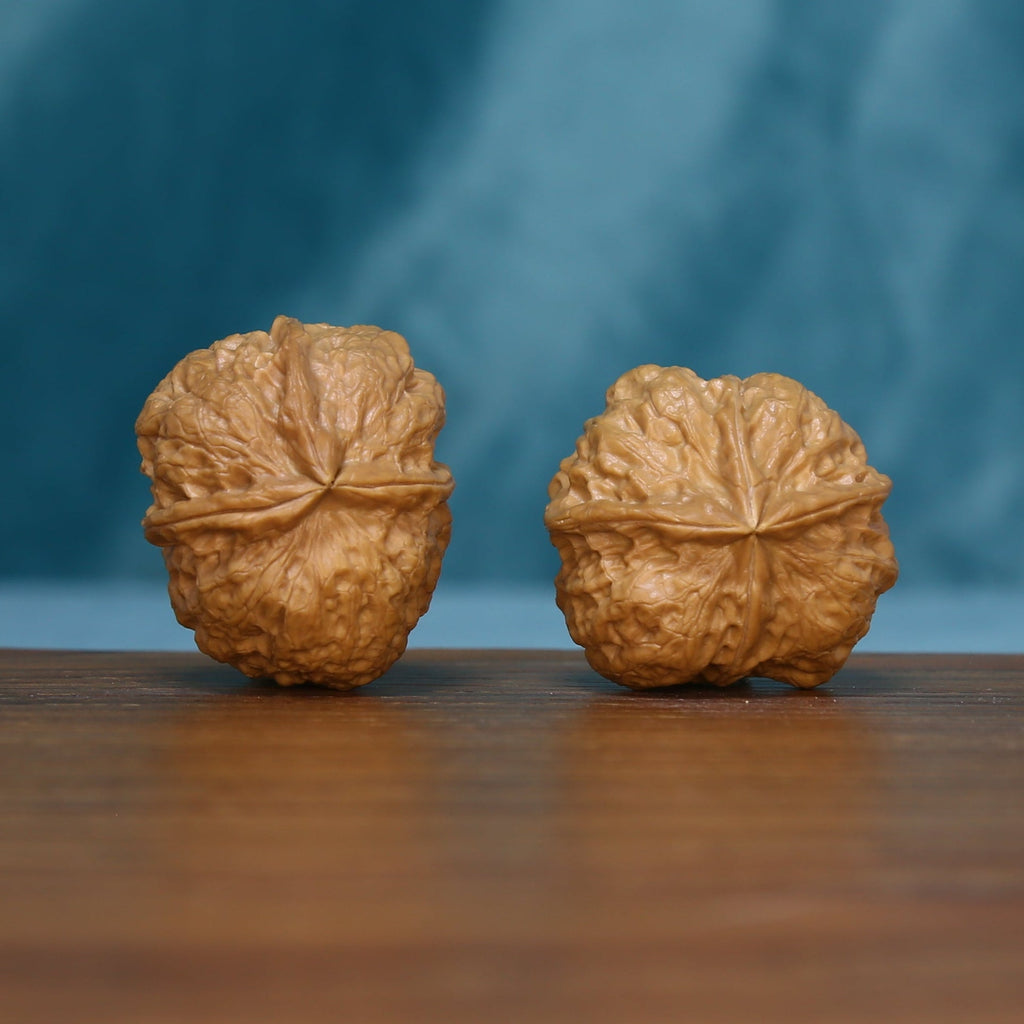 Side view of the S1314 wenwan walnut pair showing their raised ridges
