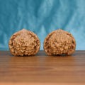 Two Wu-Ming wild wenwan walnuts on wooden surface, blue fabric background – matching sentinel's grip nameless wild set