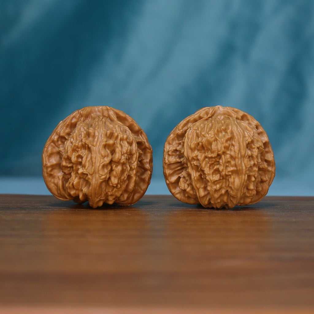 Pair of S46 White Lion wenwan walnuts with deep grooves and raised ridges
