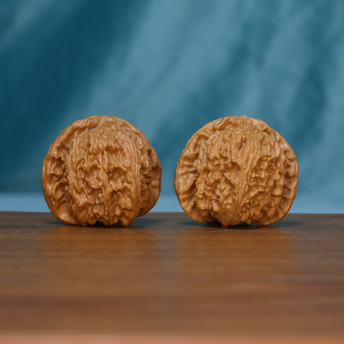 S46 White Lion wenwan walnut pair showing rounded profiles and textured surfaces
