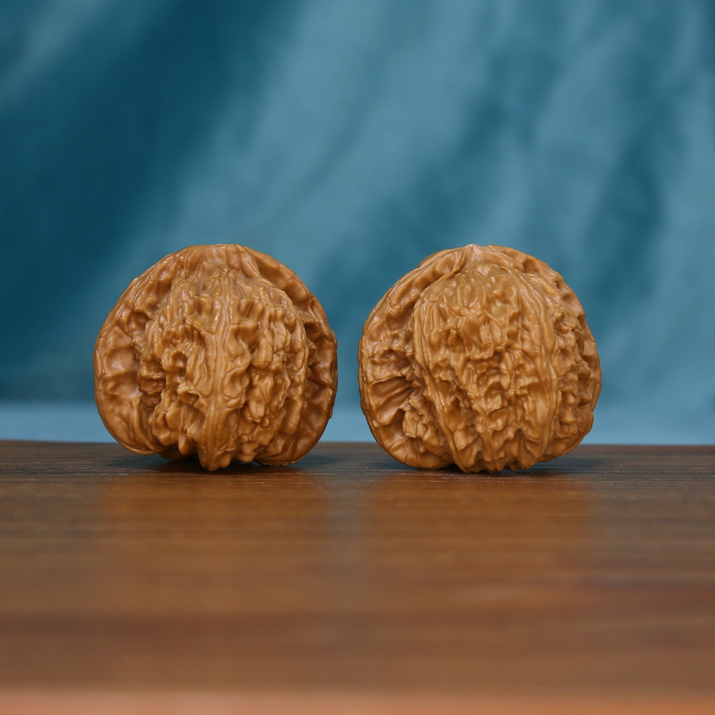 Another angle of the S46 White Lion wenwan walnut pair showing their winding grooves
