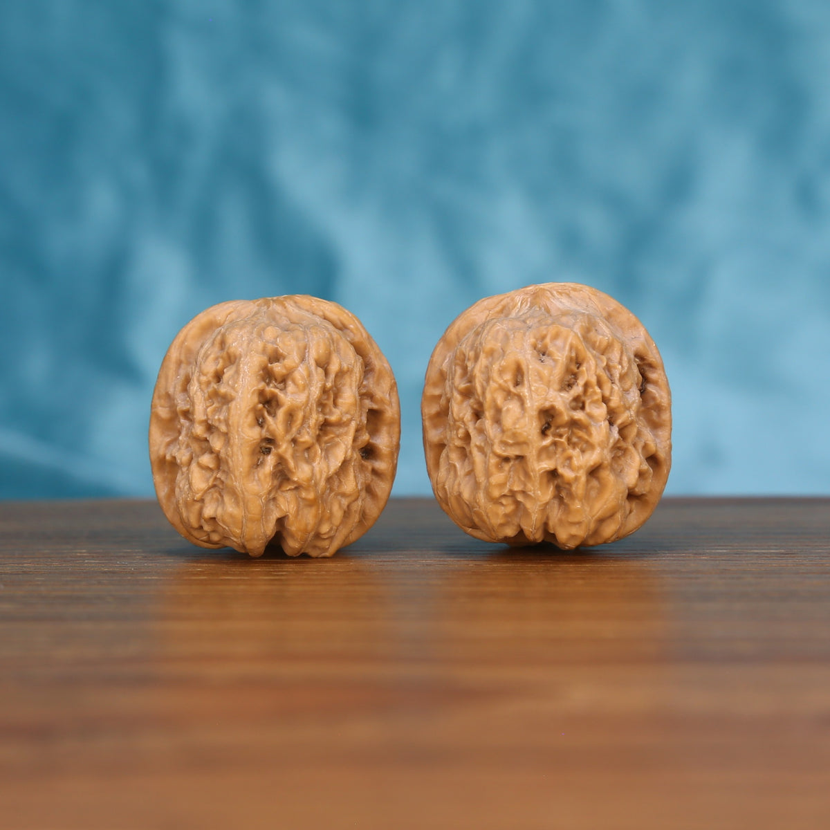The Frontier Crest Spheres | Xi-Bei-Jiang-Jun-Bang Walnut Set 5513 Matched pair of Xi-Bei-Jiang-Jun-Bang Wenwan walnuts with natural ridges