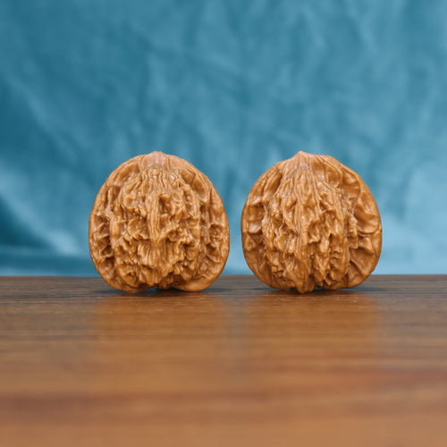 Wheat Tiger wenwan walnut pair 6192 shown side by side, front view of the matched rounded form
