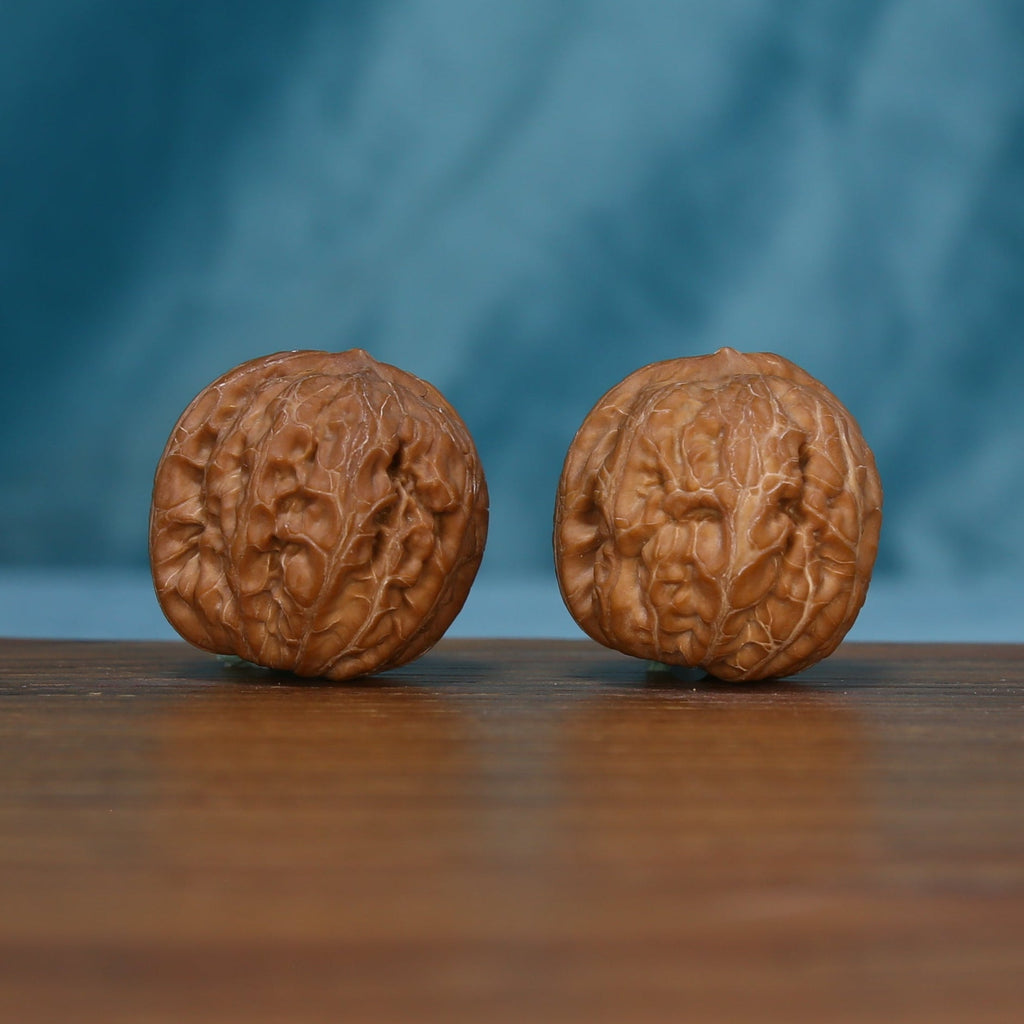 Opposite side of the Pinggu Yuanbao wenwan walnut pair, SKU 4930
