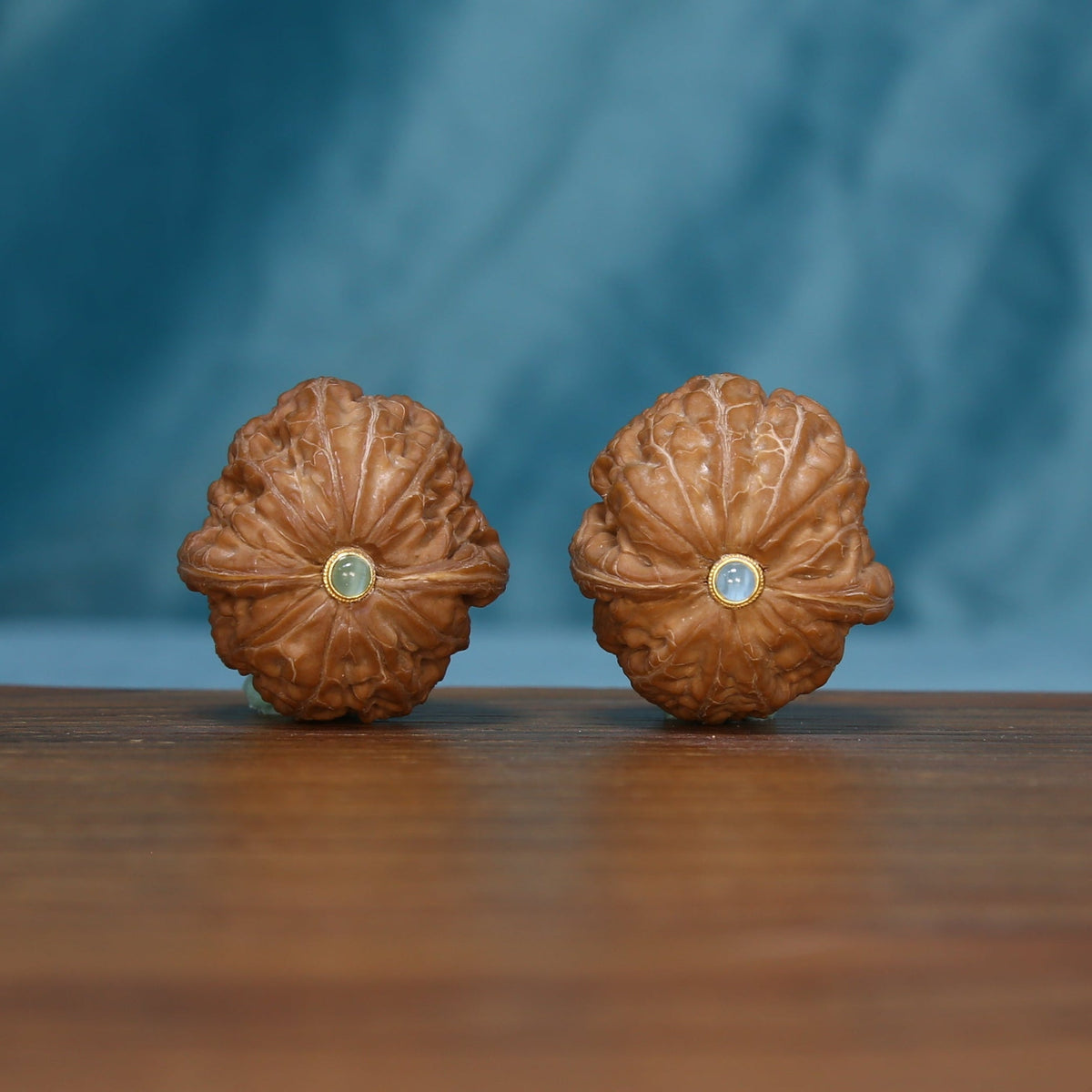 Pair of Pinggu Yuanbao wenwan walnuts showing radiating ridges, SKU 4930
