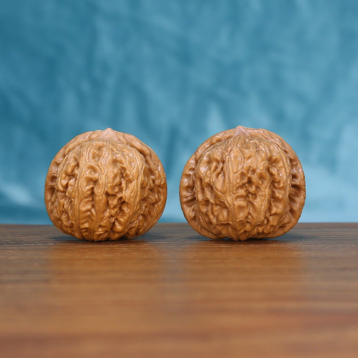 Pinggu Ingot wenwan walnut pair 6160 shown side by side, front view of the matched rounded form
