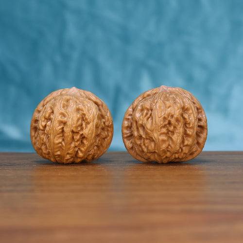Pinggu Ingot wenwan walnut pair 6160 shown side by side, front view of the matched rounded form
