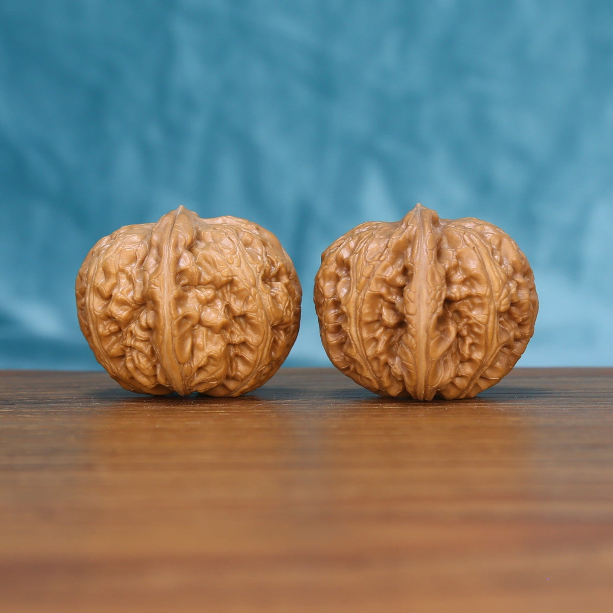 Pinggu Ingot wenwan walnut set at a slight angle, highlighting the wide belly and even shape
