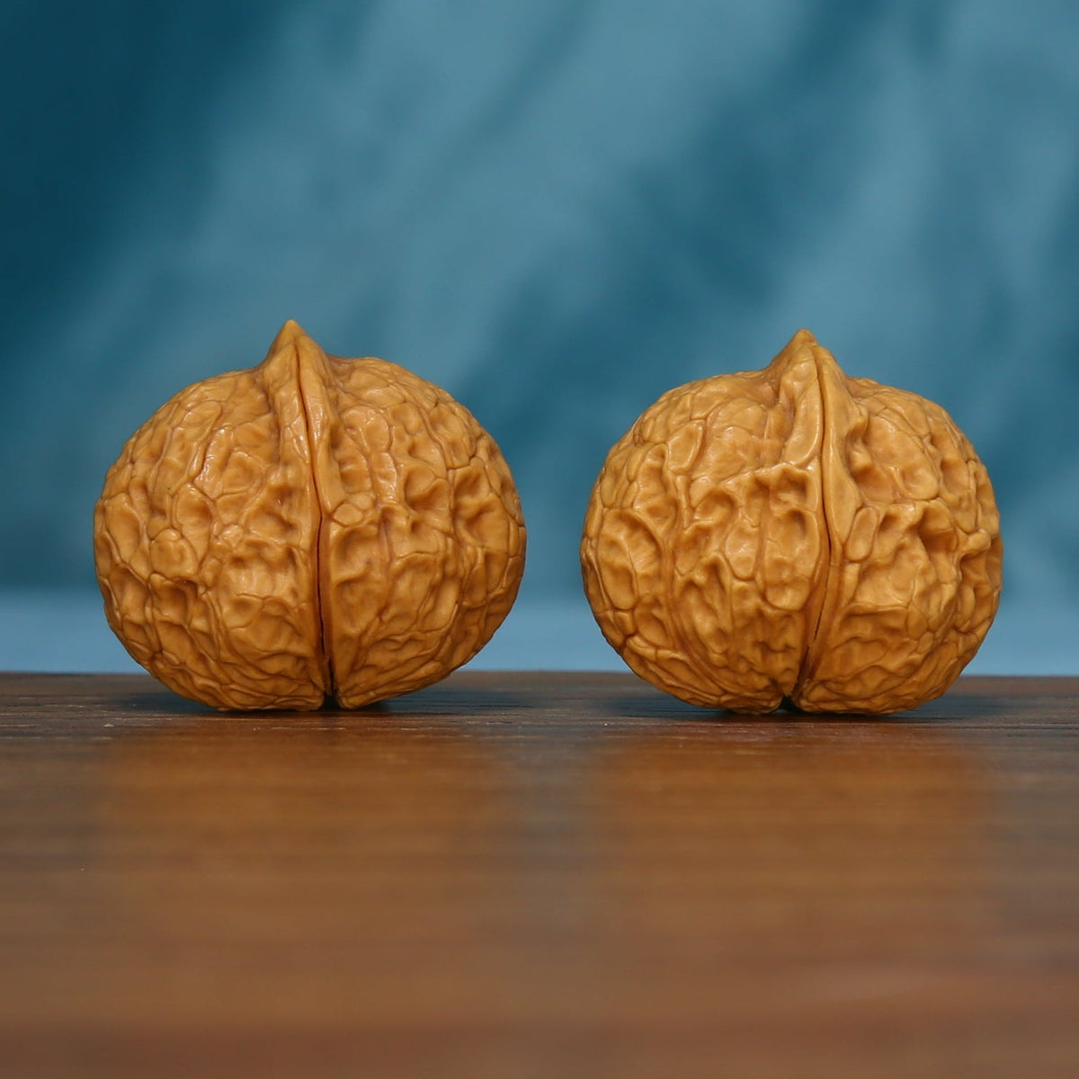 Alternate end view of the 163 wenwan walnut pair with branching ridges
