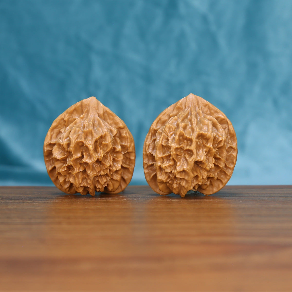 Emperor wenwan walnut pair 6115 shown side by side, front view of the matched tall form
