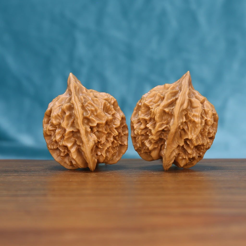 Emperor wenwan walnut set at a slight angle, highlighting the pointed crown and full body
