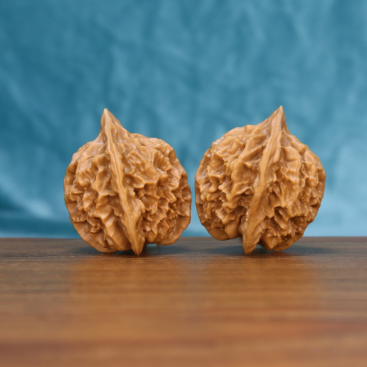 Emperor wenwan walnut set at a slight angle, highlighting the pointed crown and full body
