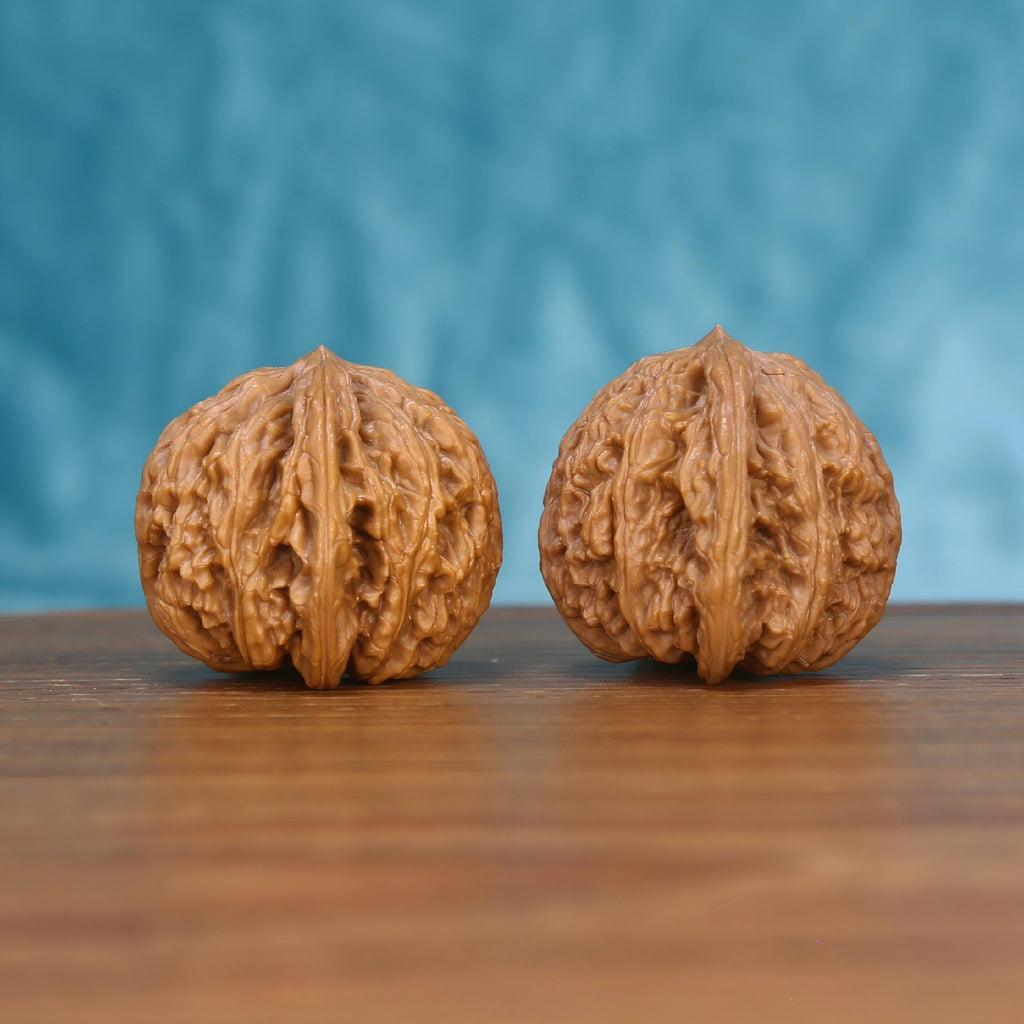 Single Wu-Ming wenwan walnut on wooden surface, blue background – rare nameless natural texture close-up