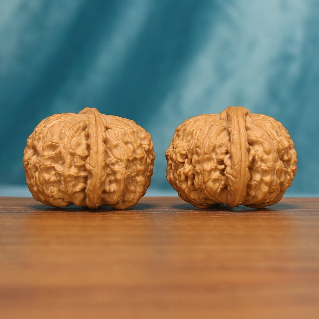Detailed side view of the White Lion Head Wenwan Walnut Set with pronounced natural ridges and surface texture.
