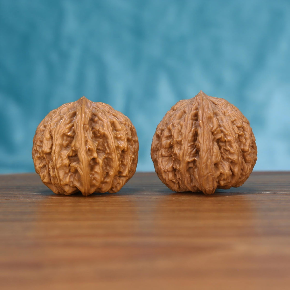 Wu-Ming wenwan walnut pair alternate angle, blue background – symmetrical mountain echo ridge pattern