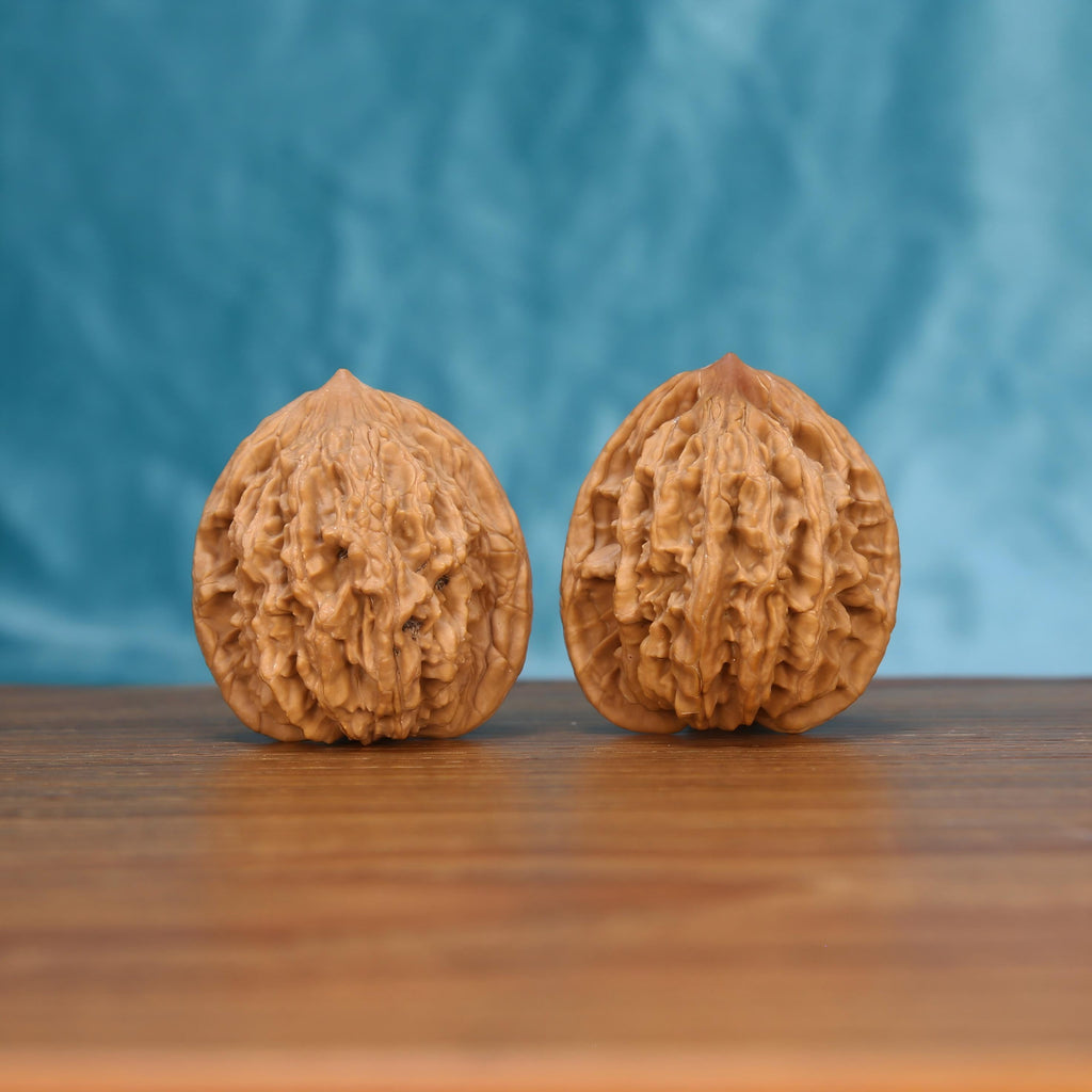 Mai-Sui Hu-Tou walnut pair front view – interlaced wheat and tiger stripe ridges by mistbodhi