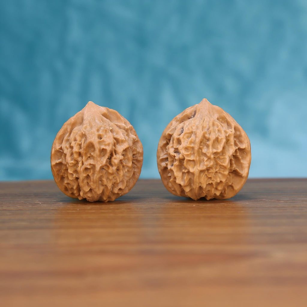 Deng-Long walnut pair front view – deeply carved labyrinth ridges and 34mm compact EDC spheres
